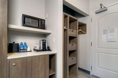 Desk, laptop workspace, iron/ironing board, free cribs/infant beds