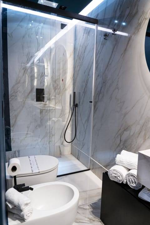 Suite, 1 Bedroom | Bathroom | Shower, rainfall showerhead, designer toiletries, hair dryer