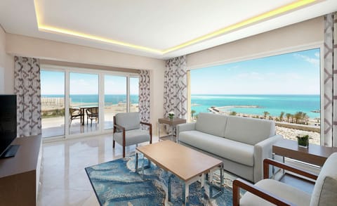 Suite, 1 King Bed, View (Blue Bay) | Living area | 55-inch Smart TV with satellite channels, TV