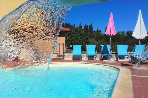 Seasonal outdoor pool, open 9:00 AM to 7:00 PM, sun loungers