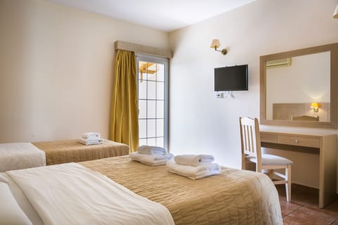 Triple Pool View Room | In-room safe, soundproofing, iron/ironing board, bed sheets