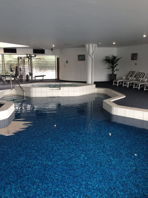 Indoor pool, open 6:00 AM to 10:00 PM, sun loungers