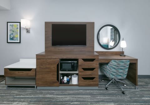 Hypo-allergenic bedding, desk, laptop workspace, blackout drapes