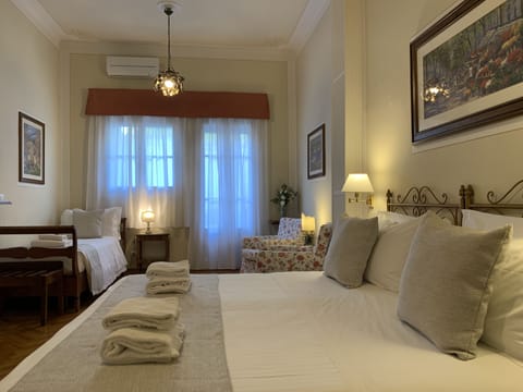 Triple Room, Ground Floor | Free minibar, in-room safe, desk, free WiFi