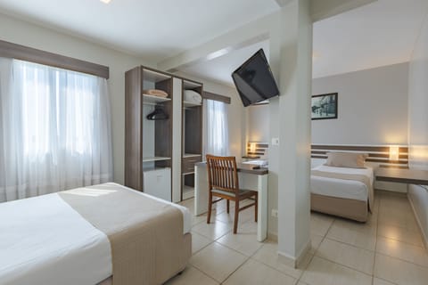 Family Room | Down comforters, minibar, desk, free WiFi