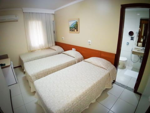 Deluxe Triple Room, 3 Twin Beds | Minibar, in-room safe, desk, free WiFi