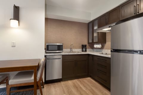 Full-size fridge, microwave, stovetop, dishwasher