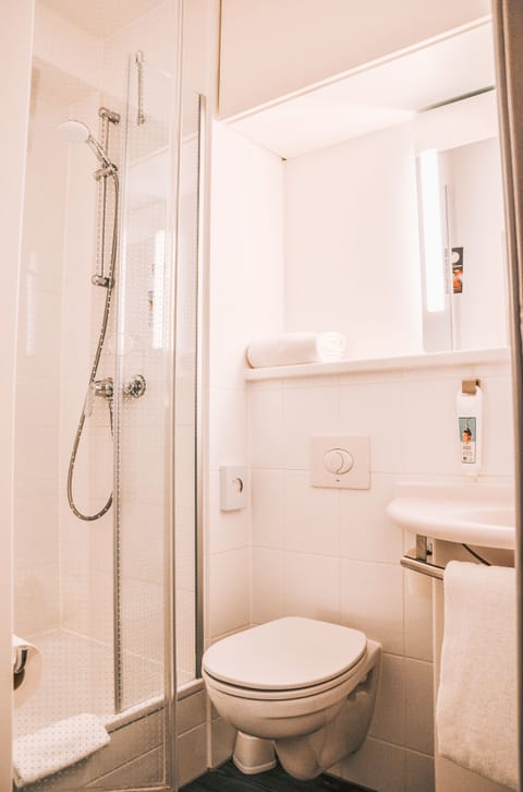 Shower, eco-friendly toiletries, hair dryer, towels