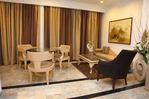 Suite, 1 Bedroom | Living room | LCD TV