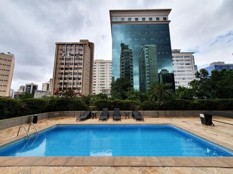 Outdoor pool, pool umbrellas, sun loungers