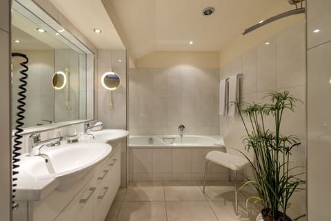 Suite | Bathroom | Hair dryer, bathrobes, slippers, towels