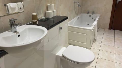 Family Room Sleeps 5 | Bathroom | Free toiletries, hair dryer, towels