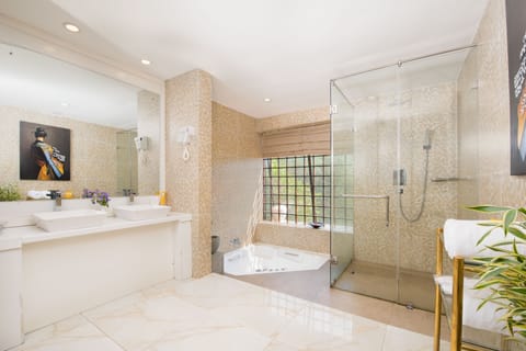 Suite | Bathroom | Separate tub and shower, rainfall showerhead, designer toiletries