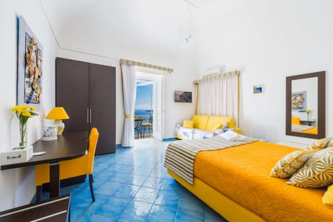 Deluxe Room, Sea View | In-room safe, individually decorated, individually furnished, desk