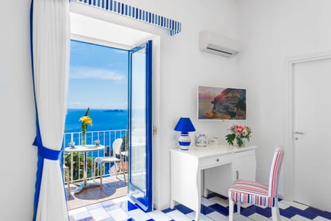 Family Room, Sea View | In-room safe, individually decorated, individually furnished, desk