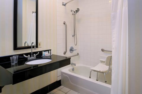 Shower, designer toiletries, hair dryer, towels