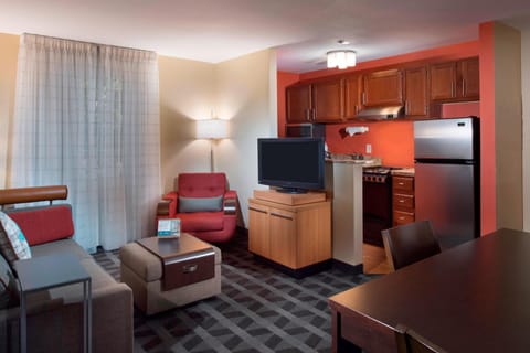 Suite, 2 Bedrooms | Living area | 32-inch flat-screen TV with cable channels, TV