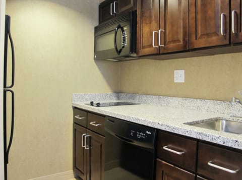 Studio Suite, 1 King Bed | Private kitchen | Full-size fridge, microwave, stovetop, dishwasher