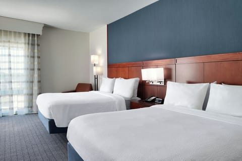 Premium bedding, desk, laptop workspace, iron/ironing board