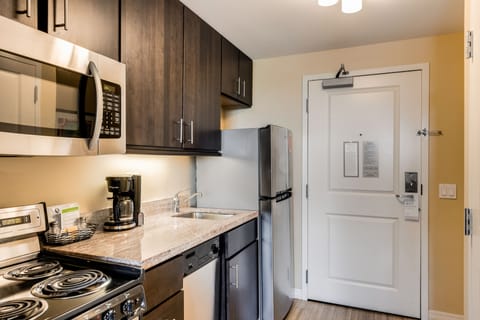 Suite, 1 Bedroom | Private kitchen | Fridge, microwave, stovetop, dishwasher