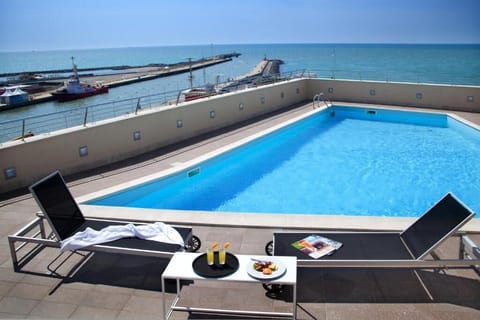 Outdoor pool, open 10:00 AM to 8:00 PM, sun loungers