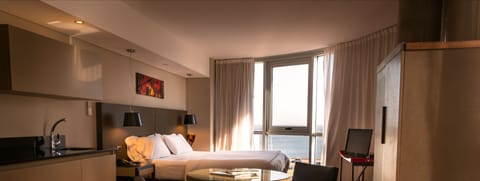 Suite, River View | Pillowtop beds, minibar, in-room safe, iron/ironing board