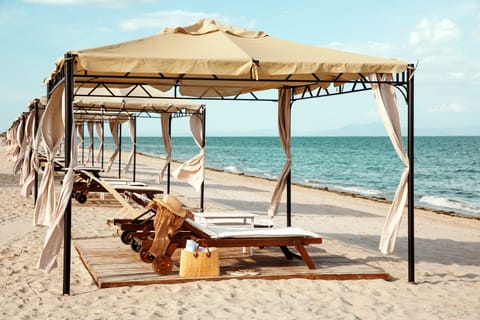 On the beach, sun loungers, beach umbrellas, beach towels