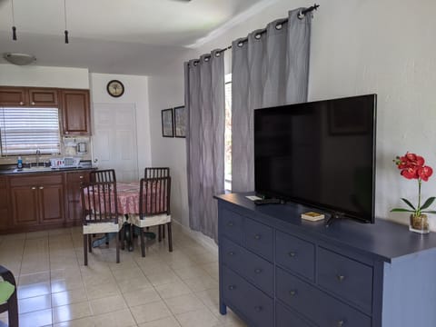 Apartment, 1 Bedroom | Living area | 32-inch TV with cable channels