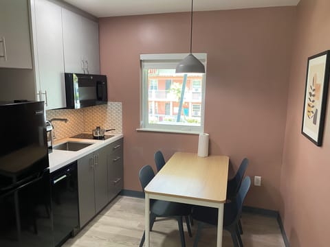 Junior Suite  (Newly Renovated Unit/Building) | Private kitchen | Microwave, highchair