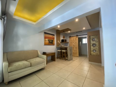 Suite, Multiple Beds | Living area | LED TV