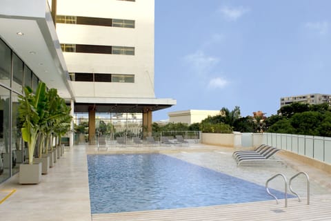 Outdoor pool, open 8:00 AM to 8:00 PM, sun loungers