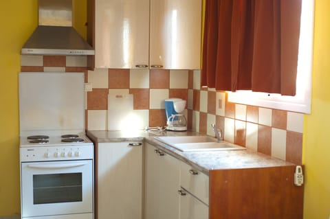 Family Apartment, 1 Bedroom (For 4) | Private kitchen | Full-size fridge, stovetop, cookware/dishes/utensils