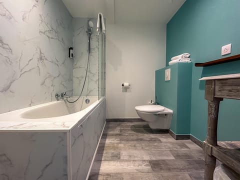 Shower, hair dryer, towels, shampoo