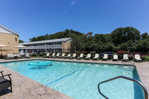 Seasonal outdoor pool, open 8:00 AM to 9:00 PM, pool umbrellas