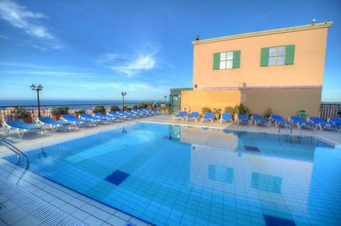 Outdoor pool, open 9:00 AM to 7:00 PM, pool umbrellas, sun loungers