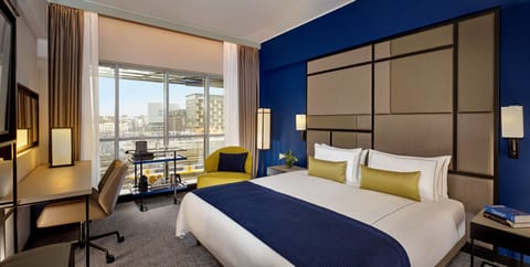 Executive Room, 1 King Bed, City View | Minibar, in-room safe, desk, laptop workspace