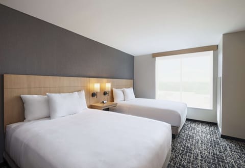 Down comforters, pillowtop beds, in-room safe, desk