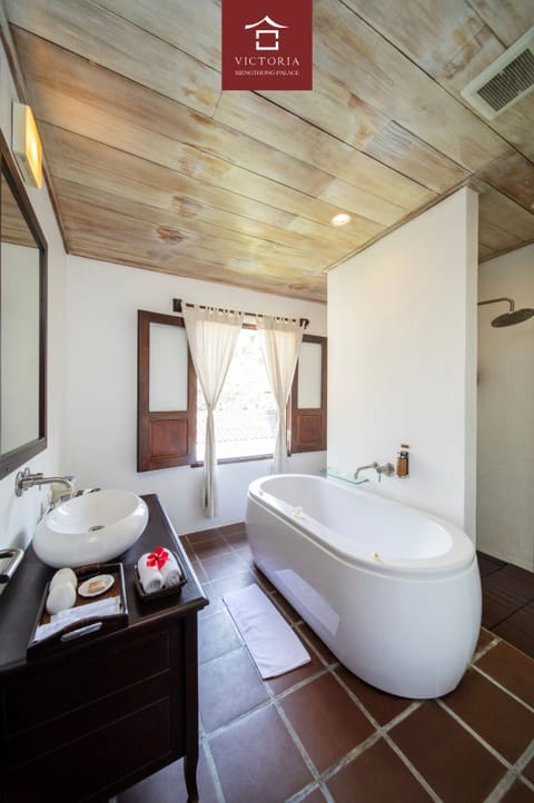 Xiengthong Villa | Bathroom | Separate tub and shower, deep soaking tub, rainfall showerhead