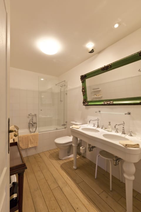 Luxury Suite | Bathroom | Bathtub, designer toiletries, hair dryer, bathrobes