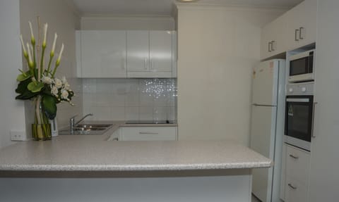 Apartment, 2 Bedrooms | Private kitchen | Fridge, microwave, coffee/tea maker, electric kettle