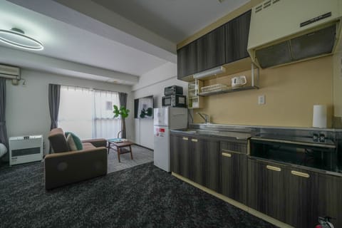 Comfort Apartment, Non Smoking (603) | Private kitchen | Full-size fridge, microwave, stovetop, toaster