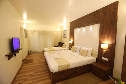 Deluxe Triple Room, 1 Bedroom, Balcony | 3 bedrooms, hypo-allergenic bedding, blackout drapes, iron/ironing board