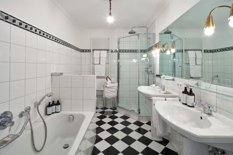 Superior Suite | Bathroom | Rainfall showerhead, designer toiletries, hair dryer, bathrobes