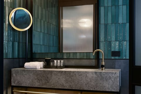 Designer toiletries, hair dryer, bathrobes, slippers