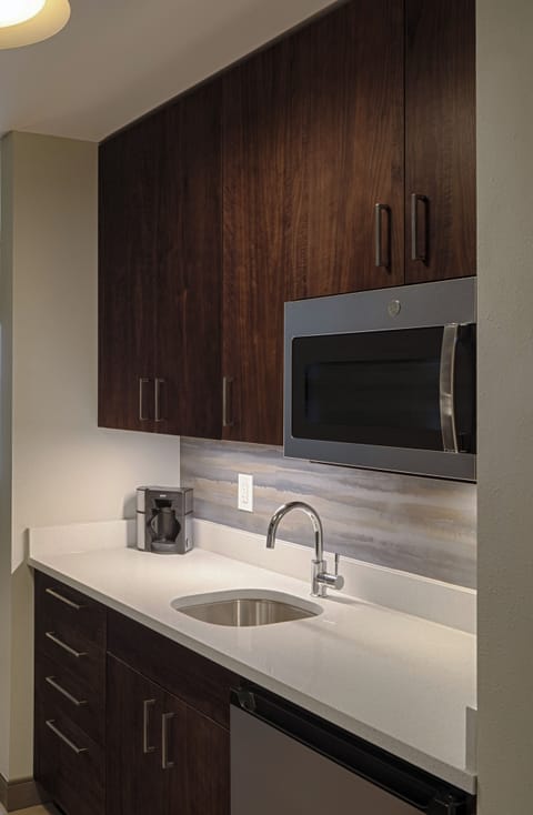 Hypo-allergenic bedding, desk, laptop workspace, blackout drapes