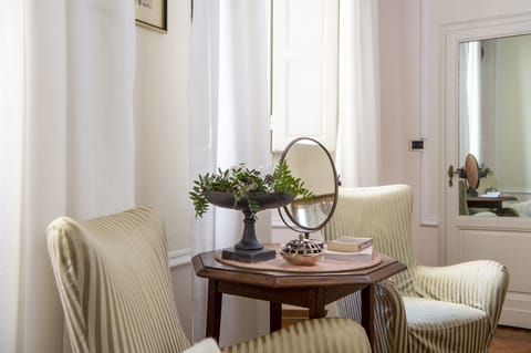 Junior Suite | Living area | 36-inch LED TV with satellite channels, TV