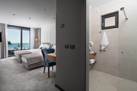 Superior Triple Room, Balcony, Sea View | Living area | Flat-screen TV