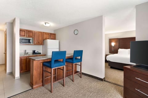 Suite, 2 Queen Beds, Non Smoking | Desk, blackout drapes, iron/ironing board, free cribs/infant beds