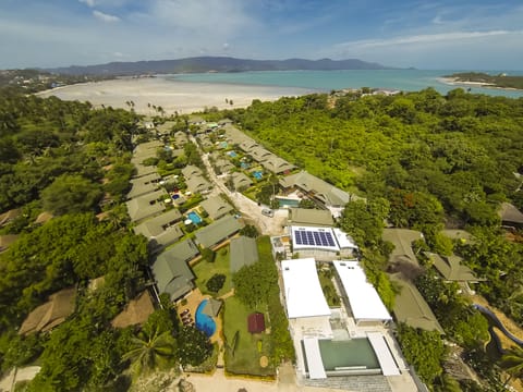 On the beach, white sand, sun loungers, beach umbrellas