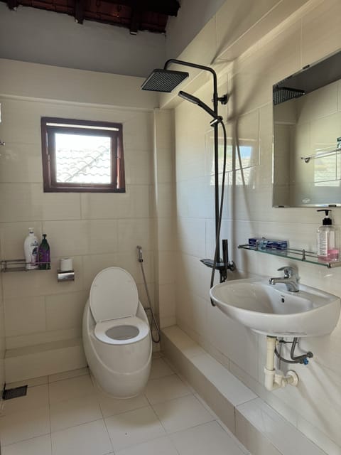 Bungalow, Beachfront | Bathroom | Shower, free toiletries, towels